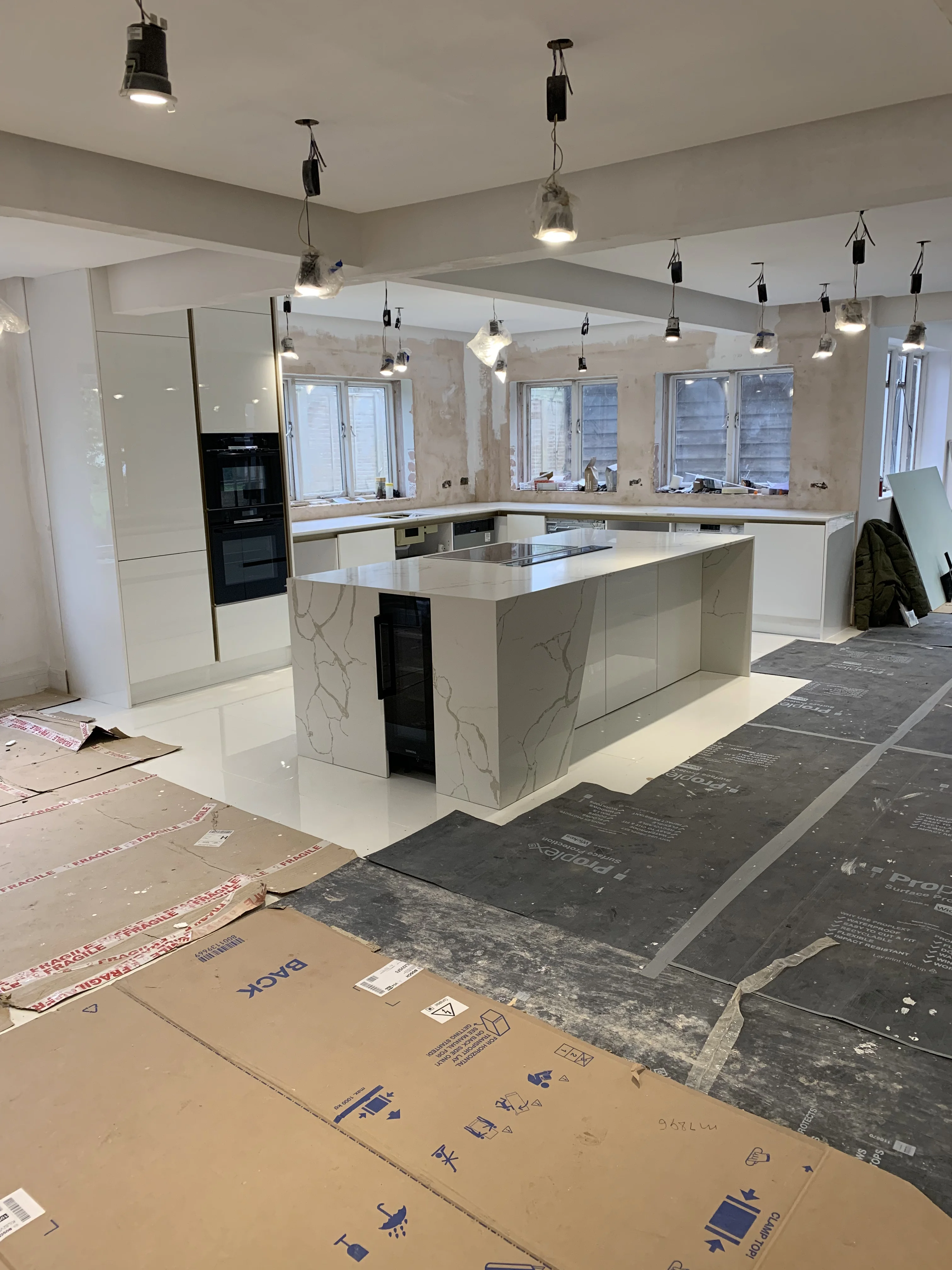 Kitchen fitter Bedworth — white kitchen with marble island fitted by Install My Kitchen, Warwickshire