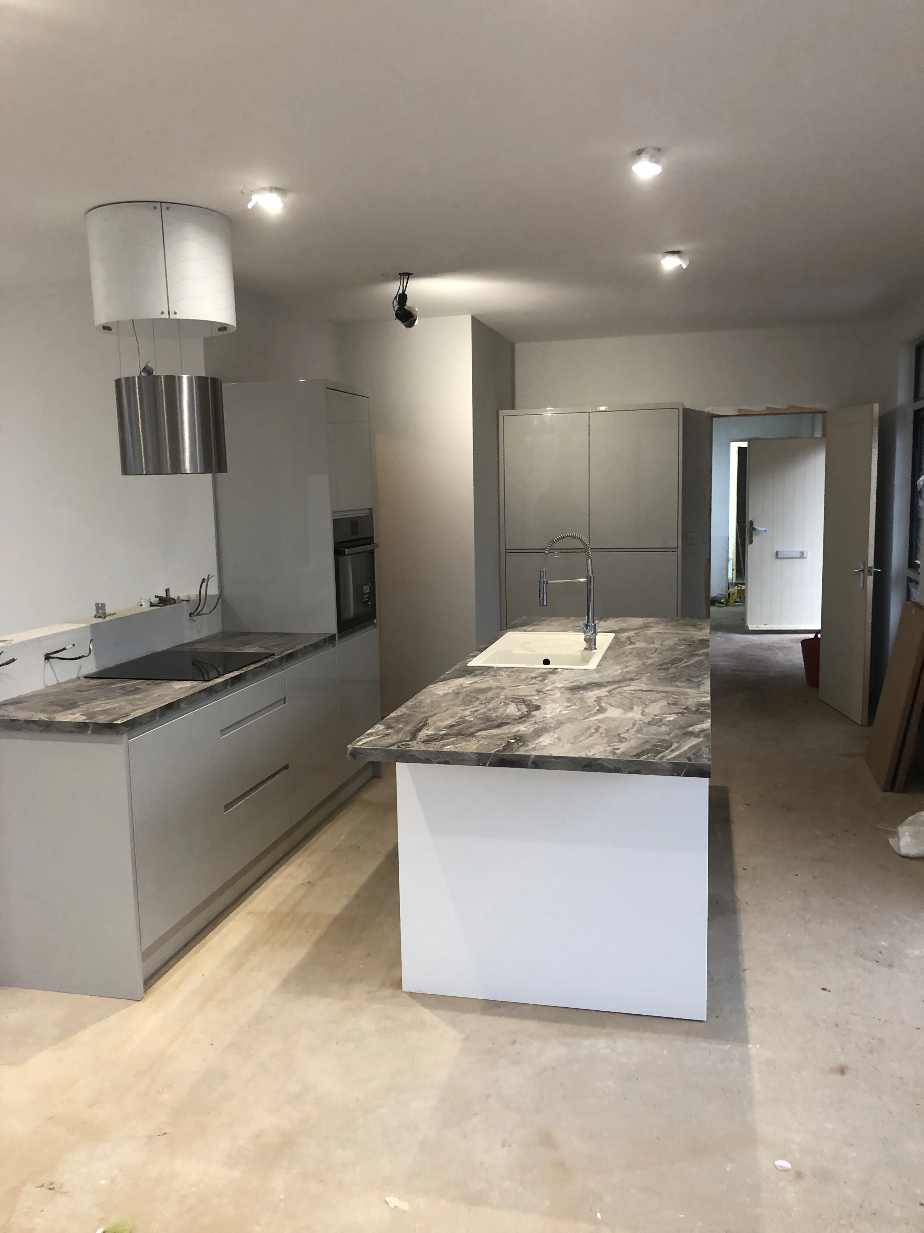 Kitchen fitter Solihull — grey handleless kitchen installation in Solihull, West Midlands by Install My Kitchen