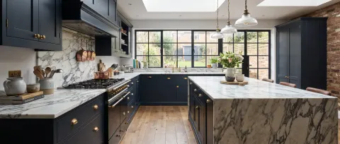 Luxury kitchen with brick splashback and copper kettle