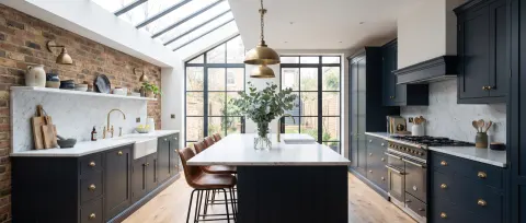 Luxury kitchen with exposed brick splashback and marble island